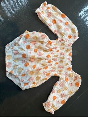 chick pea Cream Romper with Orange and Tan pumpkins
